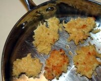 Draniki (potato panckes) frying in olive oil