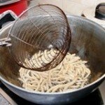 Fry the strips in boiling dough