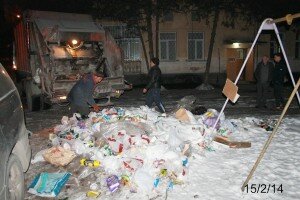 The workmen clearing up the rubbish